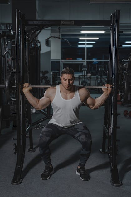 Man barbell squat